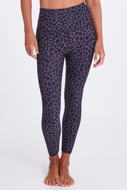 Model Alex wearing the Utopia Tight in colour Leopardsmk (Grey), from the front, cropped image
