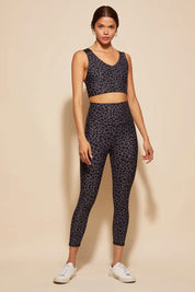 A model wearing the Utopia Tight in colour Leopardsmk (Grey), from the front, showing the whole outfit
