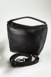 A model wearing the Addison Multiway Leather Bag in colour Black (Black), from the front, showing the whole outfit