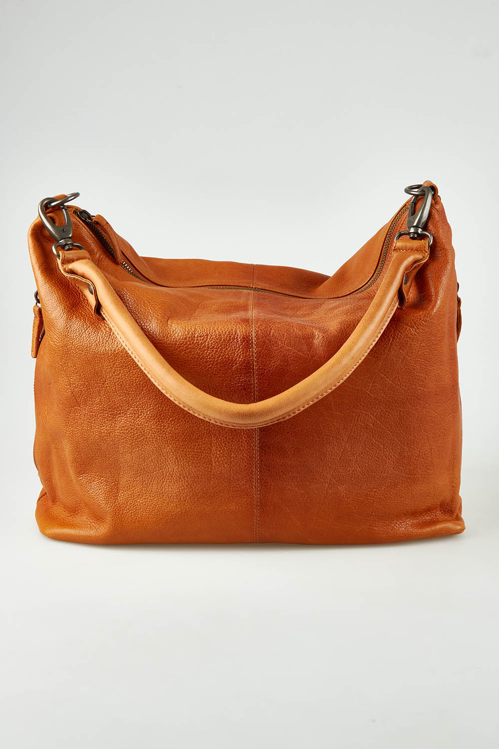 A model wearing the Adele Large Leather Bag in colour Tan, from the front, showing the whole outfit