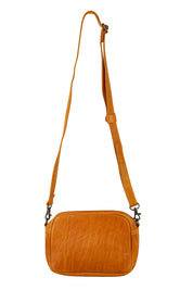 Product shot of the Head In The Clouds Leather Bag in colour Tan, from the front
