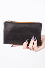 A model wearing size OneSize of the Jane Leather Purse in colour Blacktan (Black), from the front, showing the whole outfit