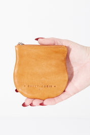 A model wearing size OneSize of the Lilly Leather Coin Purse in colour Tan, from the front, showing the whole outfit
