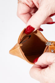 A model wearing size OneSize of the Lilly Leather Coin Purse in colour Tan, from the front, showing the whole outfit