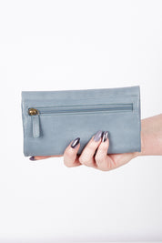 A model wearing size OneSize of the Rose Leather Purse in colour Steelgrey (Grey), from the front, showing the whole outfit