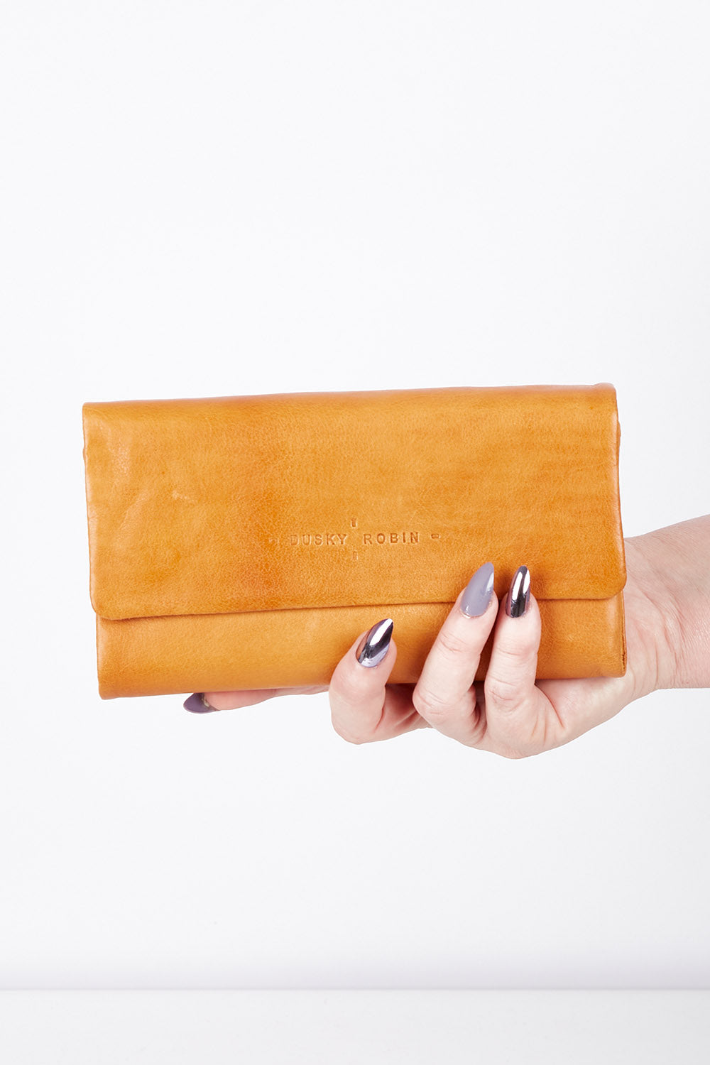 A model wearing size OneSize of the Rose Leather Purse in colour Tan, from the front, showing the whole outfit