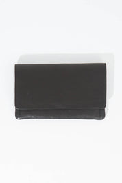 A model wearing size OneSize of the Sirena Leather Purse in colour Black (Black), from the front, showing the whole outfit