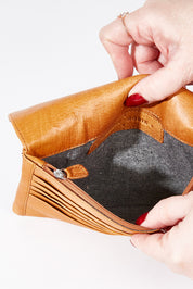 A model wearing size OneSize of the Sirena Leather Purse in colour Tan, from the front, showing the whole outfit