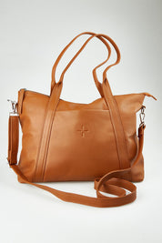 A model wearing the Valentina Leather Tote in colour Tan, from the front, showing the whole outfit