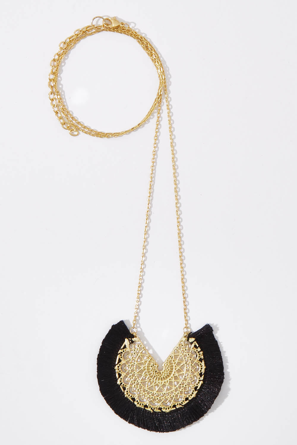 A model wearing size OneSize of the Grecia Necklace in colour Jet (Black), from the front, showing the whole outfit
