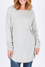 Model Katie wearing size OneSize of the Eden Knit in colour Marle (Grey), from the front, cropped image