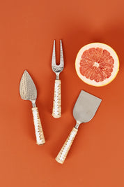 A model wearing size OneSize of the Londolozi Knife Set in colour Natural (Metallics), from the front, showing the whole outfit
