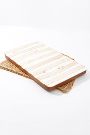 A model wearing size OneSize of the Chobe Plank Board in colour Natural, from the front, showing the whole outfit