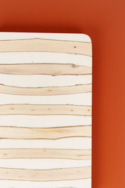 A model wearing size OneSize of the Chobe Plank Board in colour Natural, from the front, showing the whole outfit