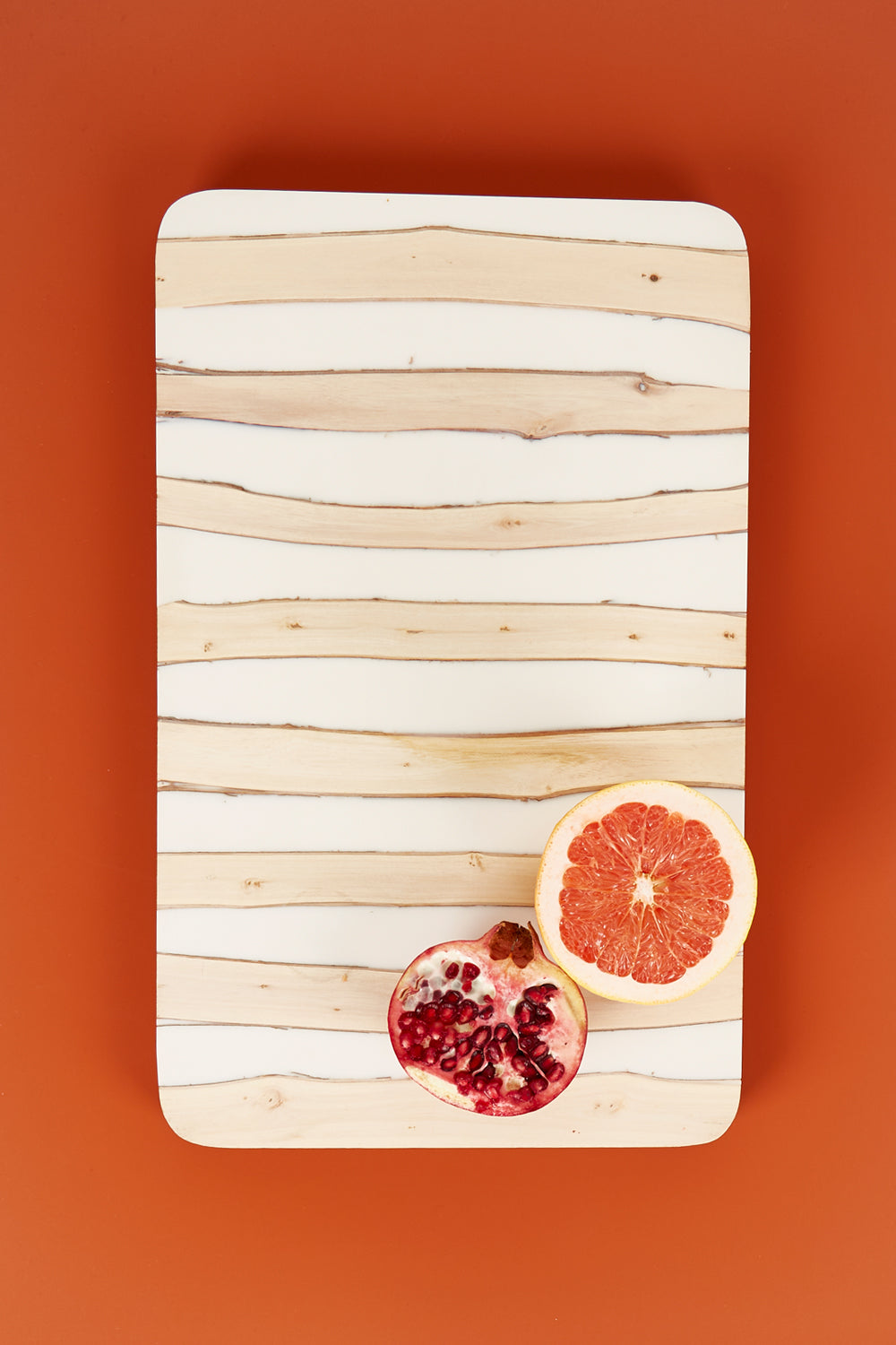 A model wearing size OneSize of the Chobe Plank Board in colour Natural, from the front, showing the whole outfit