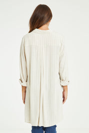 Model Tahlia wearing the Hubert Shirt in colour Hemp (White), from the front, cropped image