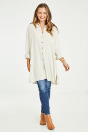 Model Tahlia wearing the Hubert Shirt in colour Hemp (White), from the front, showing the whole outfit