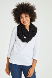 Model Olivia wearing size OneSize of the Astor Snood in colour Raven (Black), from the front, cropped image