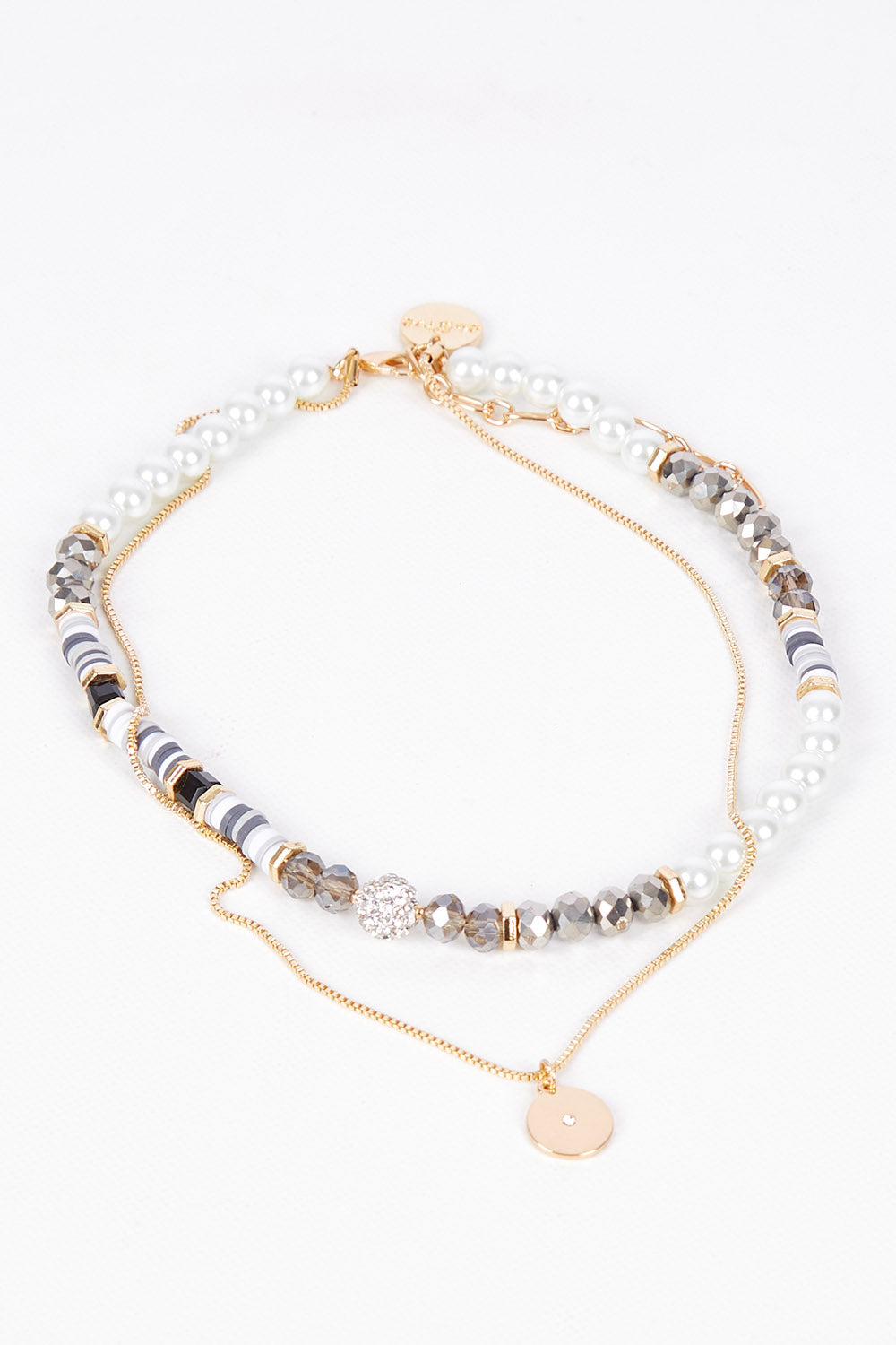 A model wearing size OneSize of the Qualia Beaded Necklace in colour Pebble, from the front, showing the whole outfit