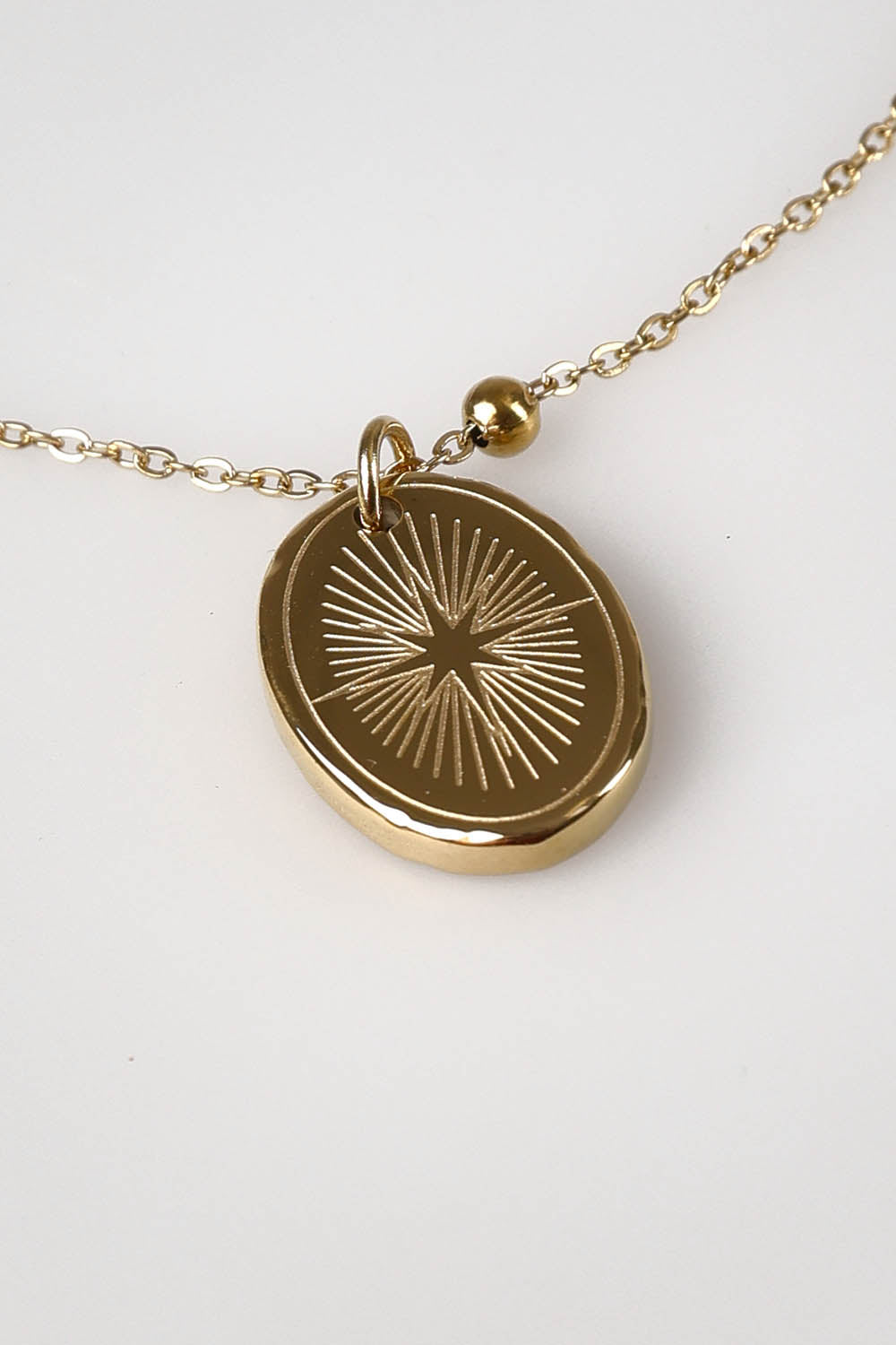 A model wearing the Heritage Necklace in colour Goldshine (Metallics), from the front, showing the whole outfit