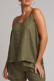 A model wearing the Studio Linen Tank in colour Khaki (Green), from the front, cropped image