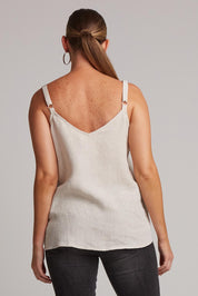 A model wearing the Studio Linen Tank in colour Tusk, from the back