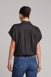 A model wearing the Studio Linen Tie Shirt in colour Ebony (Black), from the back