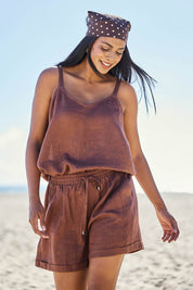 Model Eshan wearing size 10 of the Studio Linen Short – Chocolate in colour Chocolate, in a cropped view
