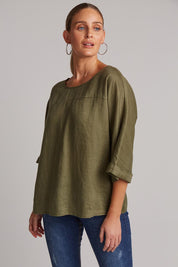 A model wearing the Studio Relaxed Top in colour Khaki (Green), from the front, cropped image