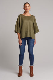 A model wearing the Studio Relaxed Top in colour Khaki (Green), from the front, showing the whole outfit