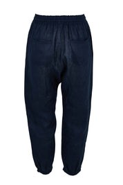 Product shot of the Studio Relaxed Linen Pant in colour Navy (Blue), from the back