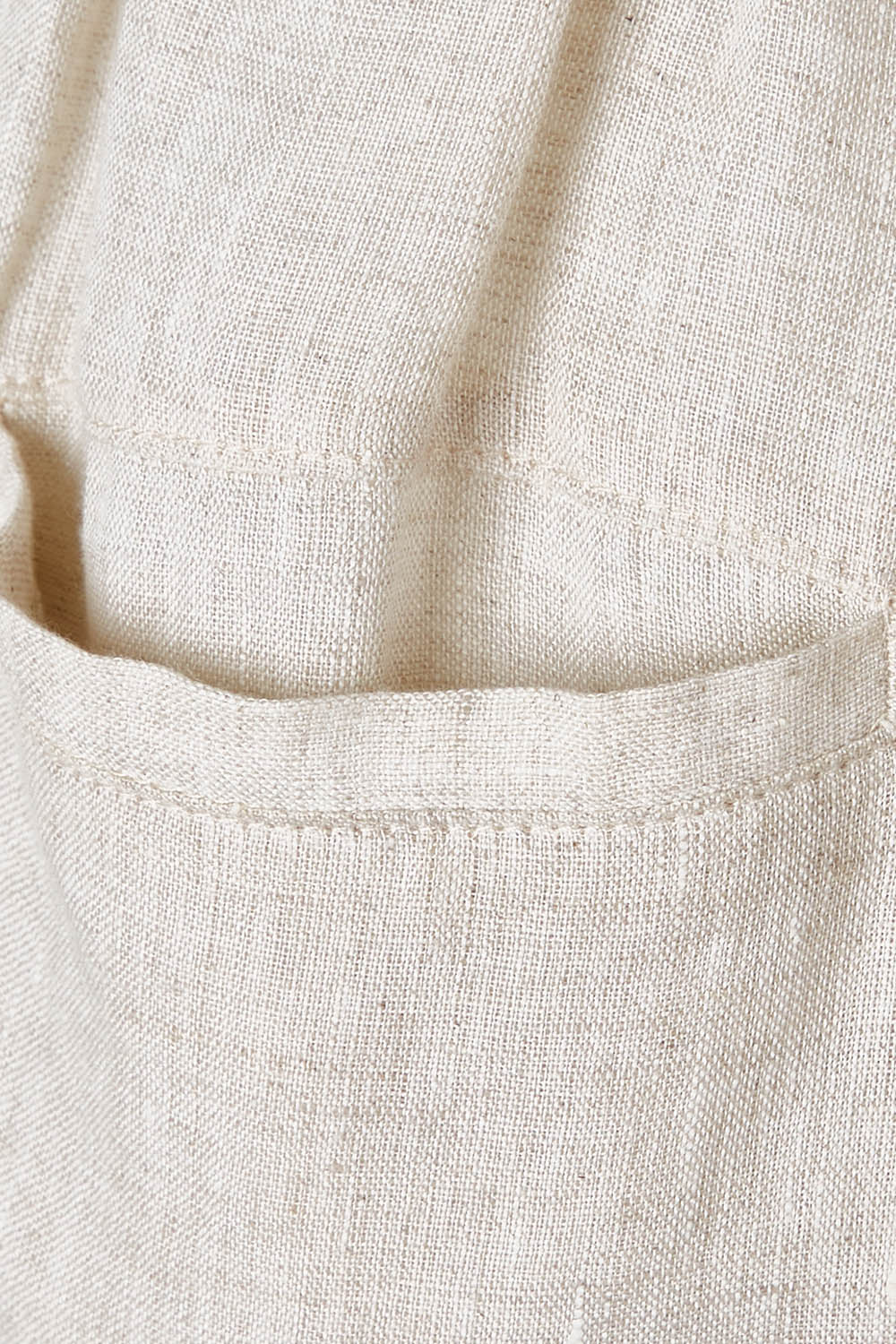 Product shot of the Studio Relaxed Linen Pant in colour Tusk, detail