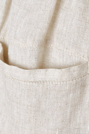 Product shot of the Studio Relaxed Linen Pant in colour Tusk, detail