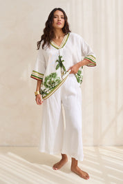 Model Tahnee wearing size S of the Studio Crop Pant in colour Salt (White), from the front, showing the whole outfit