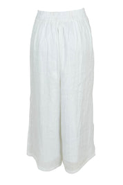 Product shot of the Studio Crop Pant in colour Salt (White), from the back