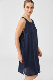 A model wearing the Studio Linen Midi Dress in colour Navy (Blue), from the front, cropped image