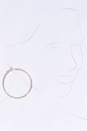 A model wearing size OneSize of the Fleur Hoop Earring in colour Gold (Metallics), from the front, showing the whole outfit