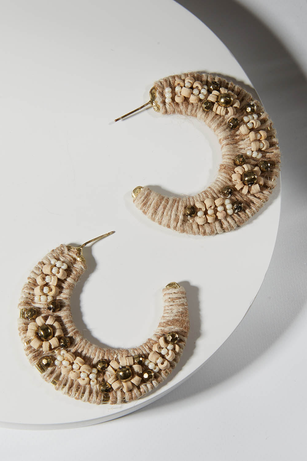A model wearing size OneSize of the Soma Hoop Earring in colour Hoop (Metallics), from the front, showing the whole outfit