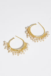 A model wearing size OneSize of the Belladonna Pearl Earring in colour Hoop (Metallics), from the front, showing the whole outfit