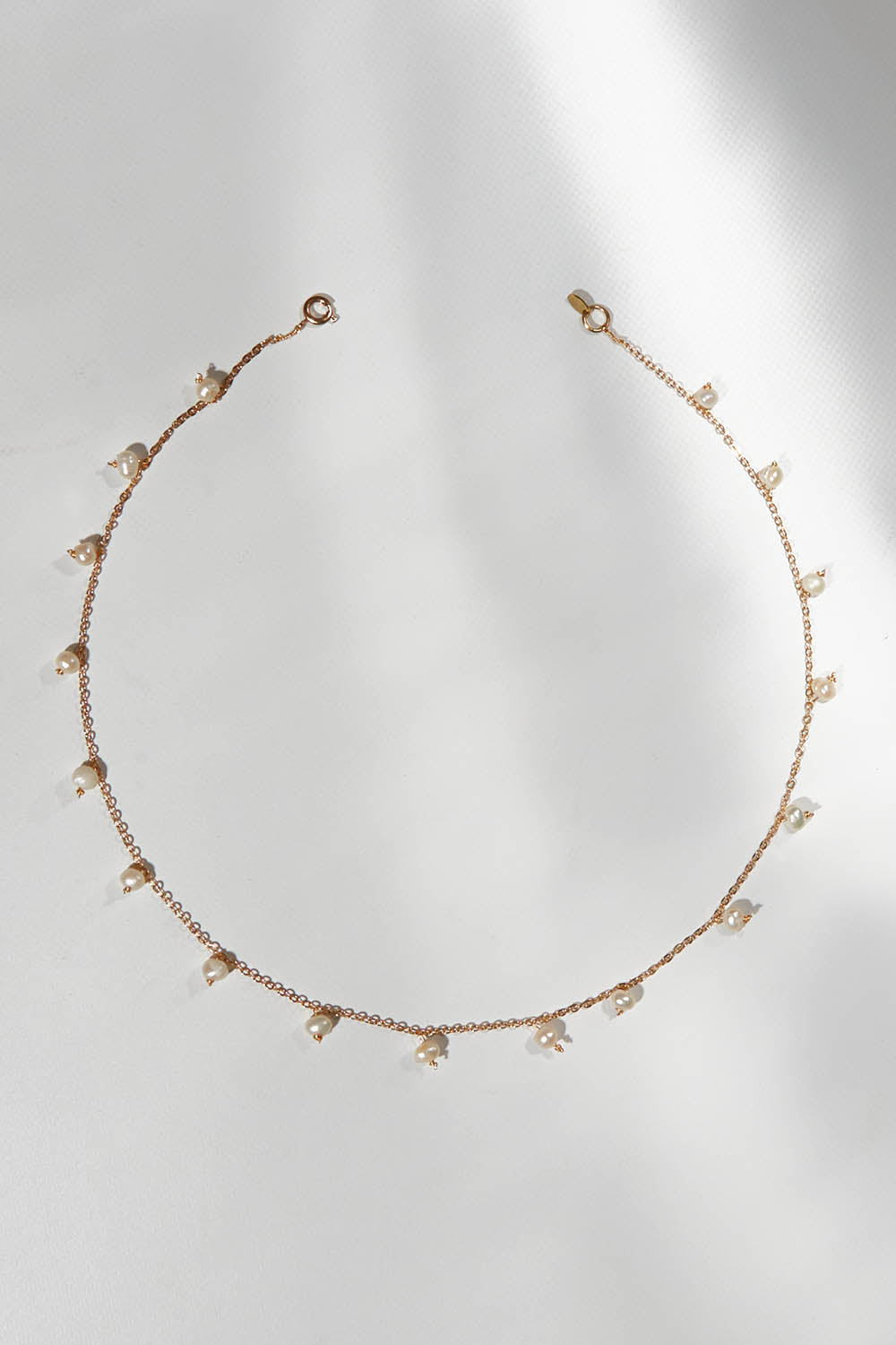 A model wearing size OneSize of the Belladonna Pearl Drop Necklace in colour Pearldrop (Metallics), from the front, showing the whole outfit