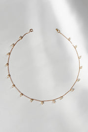 A model wearing size OneSize of the Belladonna Pearl Drop Necklace in colour Pearldrop (Metallics), from the front, showing the whole outfit