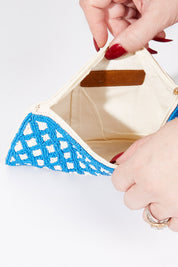 A model wearing size OneSize of the Eros Diamond Clutch in colour Capri (Blue), from the front, showing the whole outfit