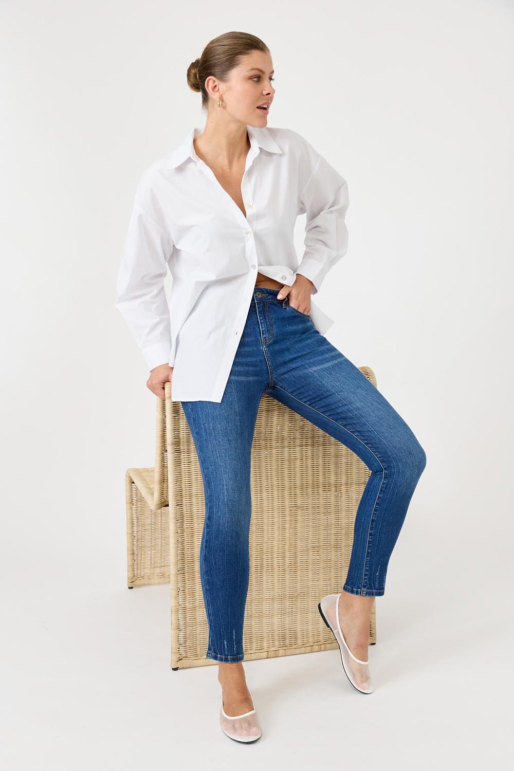 A model wearing the Studio Oversize Cotton Shirt in colour Salt (White), from the front, showing the whole outfit