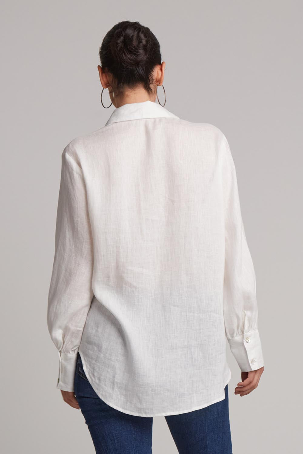 A model wearing the Studio Linen Shirt in colour Salt (White), from the back