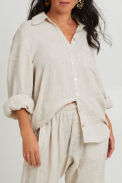 Model Katie wearing size S of the Studio Linen Shirt in colour Tusk, from the front, cropped image