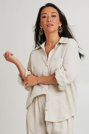 Model Katie wearing the Studio Linen Shirt in colour Tusk, from the front, cropped image