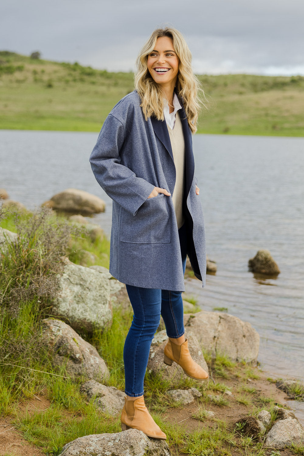 Model Alice wearing size OneSize of the Klein Duster Coat in colour Denim (Blue), from the front, showing the whole outfit