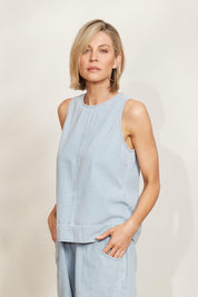 A model wearing the Playa Cotton Tank in colour Capri (Blue), from the front, showing the whole outfit