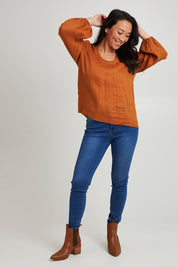 Model Katie wearing size S of the Nama Top in colour Ochre, from the front, showing the whole outfit