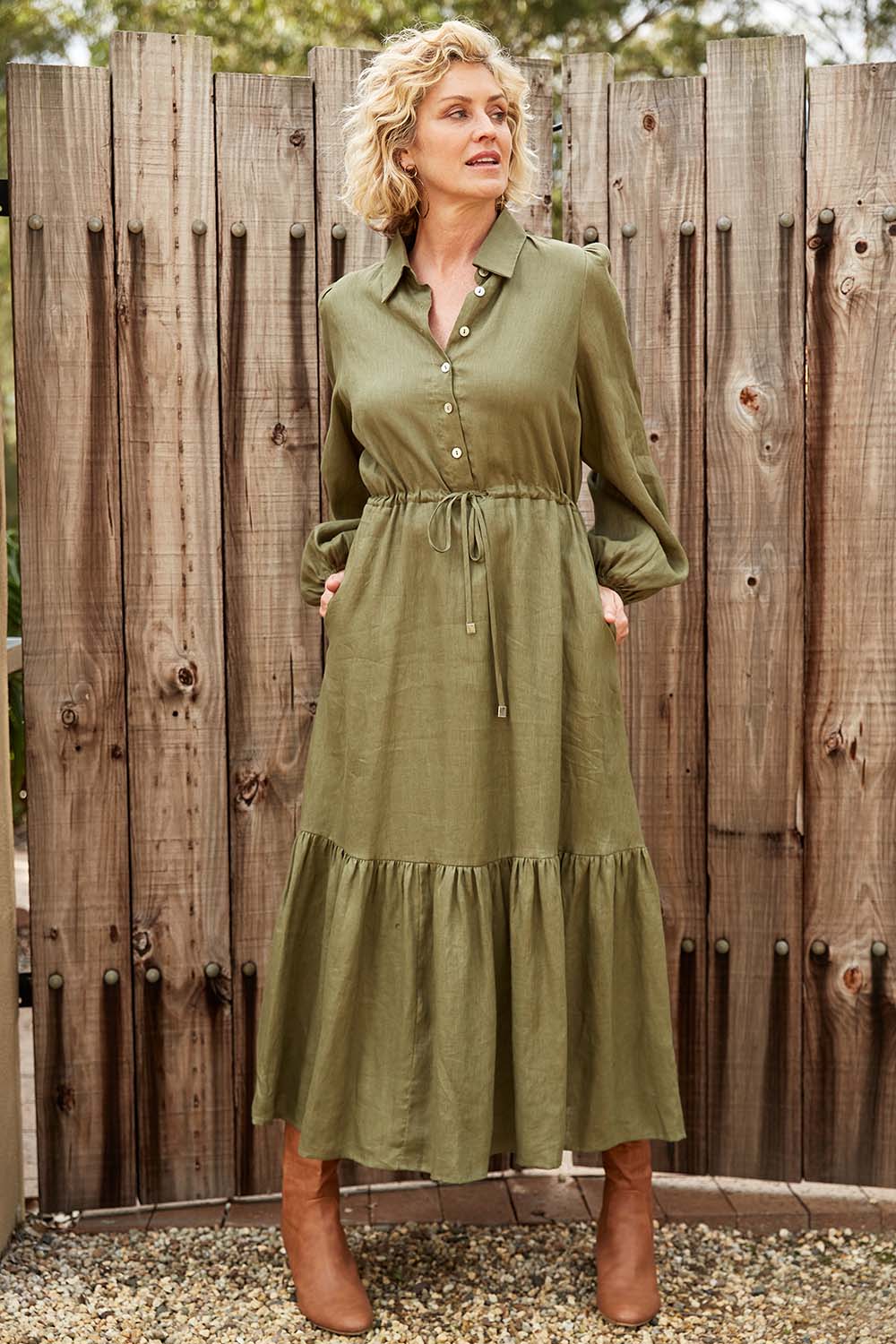 A model wearing the Nama Shirt Dress in colour Fern (Green), from the front, showing the whole outfit